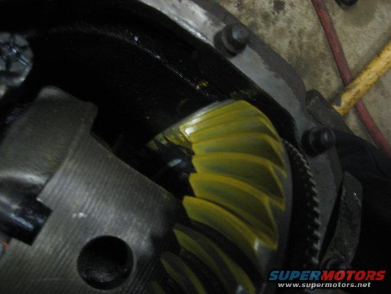 Close-up of a yellow differential gear and housing