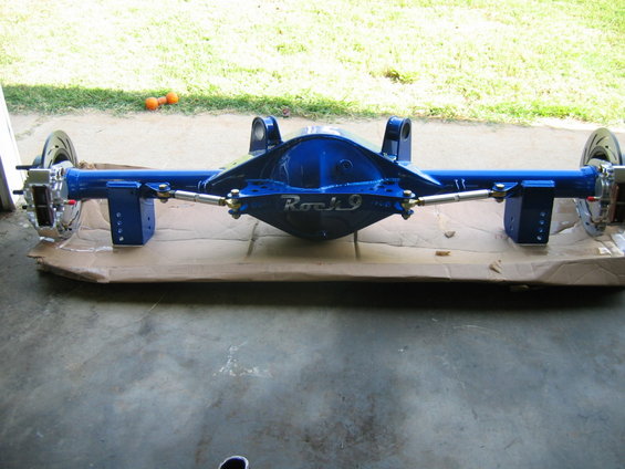 Blue rear axle assembly with 'Rock 9' label