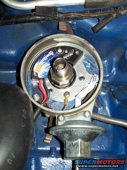 100_3046.jpg Pertronix Ignitor III ignition module has been installed; this new module has a built in rev-limiter {adjustable up to 9,000 rpm in 100 rpm increments} and multiple spark discharge capability.

This is just a stock Ford single point distributor that I installed lightweight springs into, and a bronze drive gear {to go with the billet camshaft}