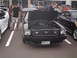 1978 Ford Mustang II - A black 1978 Ford Mustang II is displayed with its hood open, parked among other vehicles at an outdoor event.