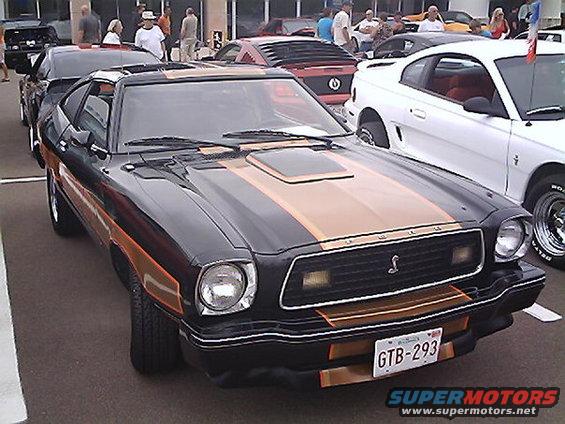 Black and gold 1978 Ford Mustang II 3/4 front view with racing stripes