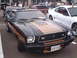 1978 Ford Mustang II - This 1978 Ford Mustang II features a distinctive black and gold color scheme with racing stripes.