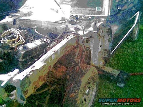1978 Ford Mustang II engine bay with exposed engine and rusty front end