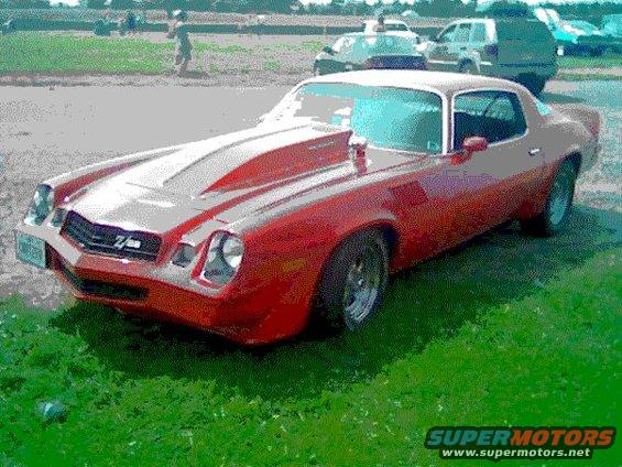 Red 1978 Chevrolet Camaro Z/28, 3q-front view, with hood scoop and racing stripes