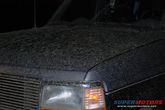 1995 Ford Bronco hood and front fender covered in mud