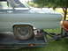 1964 Ford Fairlane - A classic car, likely a 1963 model, is loaded onto a trailer for transport.