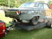 1964 Ford Fairlane - This 1964 Ford Fairlane is being transported on a trailer, with visible primer and rust.