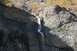 1990 Chevrolet Suburban - A waterfall flows down a mountainside during autumn.