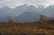 1990 Chevrolet Suburban - Mountain landscape with snow-capped peaks and fall colors in the foreground.