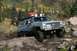 1990 Chevrolet Suburban - This 1990 Chevrolet Suburban navigates a challenging rocky trail with its tires covered in mud.