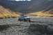 1990 Chevrolet Suburban - A K5 Blazer navigates a , rocky terrain under a vast mountain landscape.