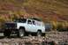 1990 Chevrolet Suburban - This modified SUV is equipped for off-road adventures, with a jerry can and spare tire on the roof rack.