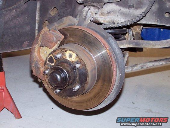 100_3065.jpg this is the stock Ford 10.7 cast iron rotor {before upgrade} with the stock ford single piston caliper.