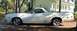 1976 Ford Ranchero - A white 1976 Ford Ranchero is parked in front of a house.