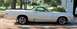 1976 Ford Ranchero - Side view of a white 1976 Ford Ranchero with aftermarket wheels.