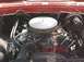 1979 Ford F-150 - Close-up view of an engine bay, a prominent chrome air cleaner and red engine components.