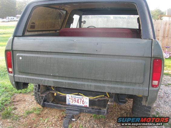 Rear view of a green Ford Bronco with an Alabama license plate reading 59476