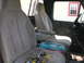 1975 Ford F-250 - Interior of a truck cab with tools and a fuel can on the passenger seat.