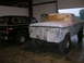 1975 Ford F-250 - This 1975 Ford F-250 pickup is undergoing preparation for a new paint job, with its front end covered in newspaper and tape.