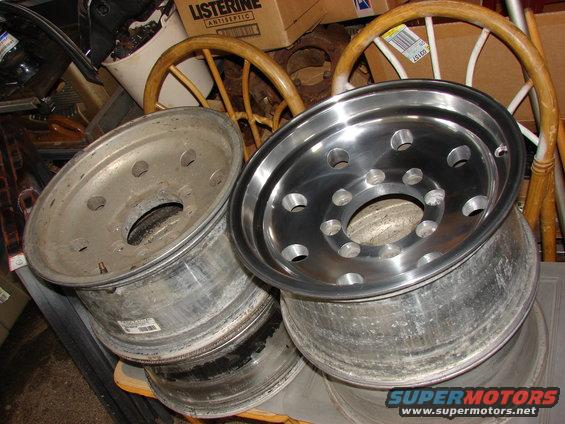 Two aluminum truck rims, one polished, one weathered