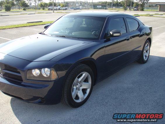 Dark blue sedan parked in a lot. Looks like a 2006 Dodge Charger