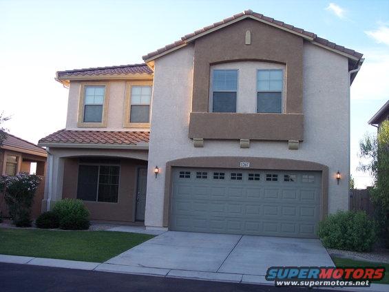 House with garage door showing address 1367