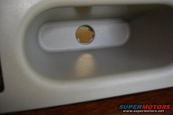 Interior door handle recess with a circular hole