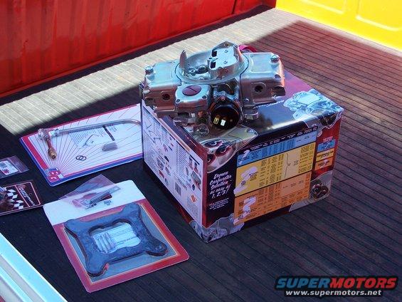 100_3113.jpg I had to buy a new fuel feed line, a fuel pressure guage, an inline fuel filter and an Edelbrock spacer (which needed trimming)