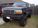 1995 Ford Bronco - This 1995 Ford Bronco features a lifted suspension and oversized tires, giving it a stance.