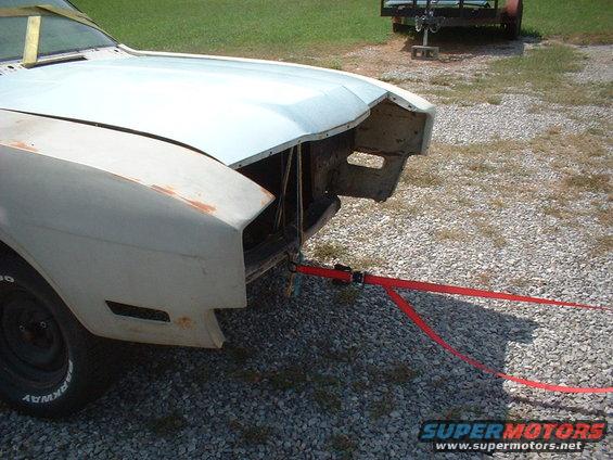 1969 Mercury Cyclone front end with hood removed, being towed by a red strap