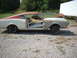 1969 Mercury Cyclone - This 1969 Mercury Cyclone is seen from the side, showing its two-tone paint scheme and open doors as it appears to be in the process of res…