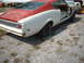 1969 Mercury Cyclone - Rear view of a 1969 Mercury Cyclone project car, showing its two-tone paint and missing body panels.