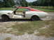 1969 Mercury Cyclone - This 1969 Mercury Cyclone is seen from the side, showing its two-tone red and white paint scheme and missing doors.