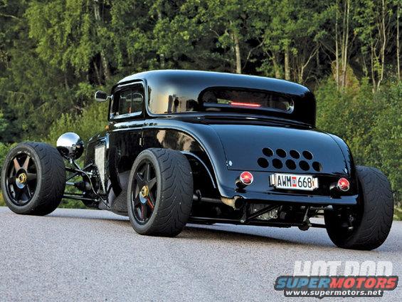 Black 1932 Ford hot rod coupe with custom wheels and exhaust