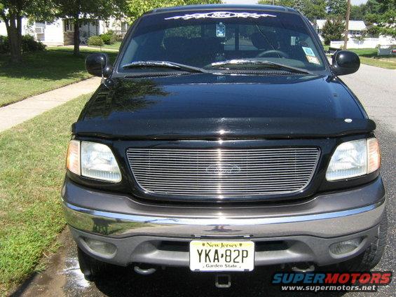 Black 2002 Ford F-150 front view with chrome grille