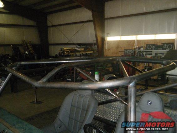 Roll cage inside a vehicle with bucket seats