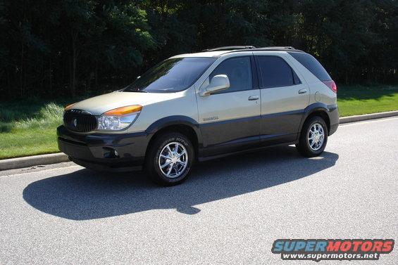 2002 Buick Rendezvous parked on asphalt with trees in background