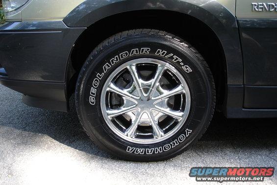 Close-up of a chrome wheel and Yokohama Geolandar H/T-S tire on a dark-colored vehicle