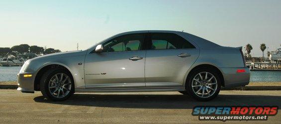 2006 Cadillac STS sedan parked by a marina, side view