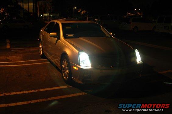 2006 Cadillac STS parked at night, front quarter view