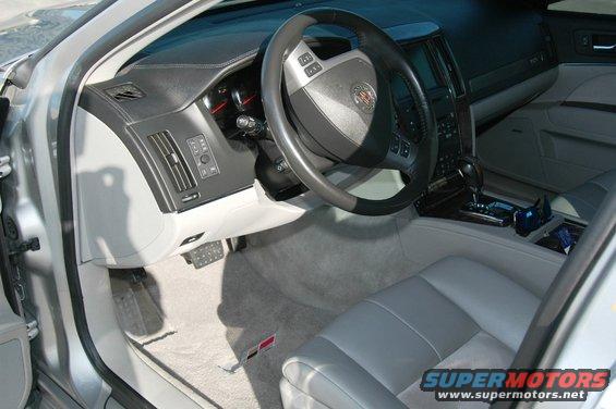 Silver 2006 Cadillac STS interior showing dashboard, steering wheel, and front seats