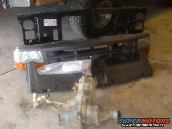 Bought this pile- complete grill with lights and header pannel, new OEM radiator core support, Lund moon visor with all the hardware and lights, BW 1356 manual transfer case for $225