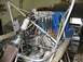 1993 Ford Taurus - Custom engine bay with exposed components and a roll cage structure.