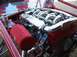 1993 Ford Taurus - Close-up of a custom engine build polished intake runners and a red air intake filter.