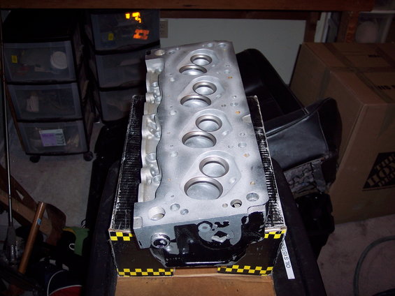 Silver engine cylinder head on a box