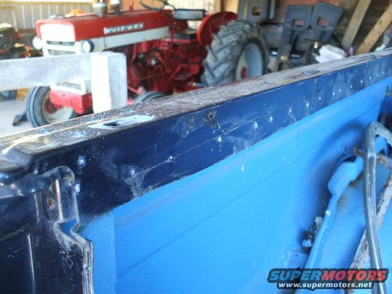 Blue interior with a red tractor behind