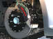 2004 Subaru Impreza - Performance brake caliper and rotor assembly with 'MOV'IT-6' branding.