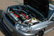 2004 Subaru Impreza - Engine bay of a 2004 Subaru Impreza, showing modifications like an intercooler and custom piping.
