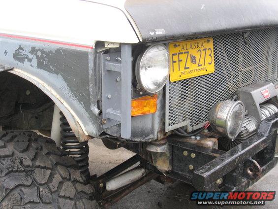 1990 Ford F-250 front corner with custom bumper, winch, and Alaska license plate FFZ 273