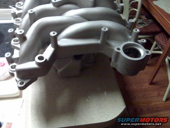 Aluminum intake manifold with multiple runners and mounting holes